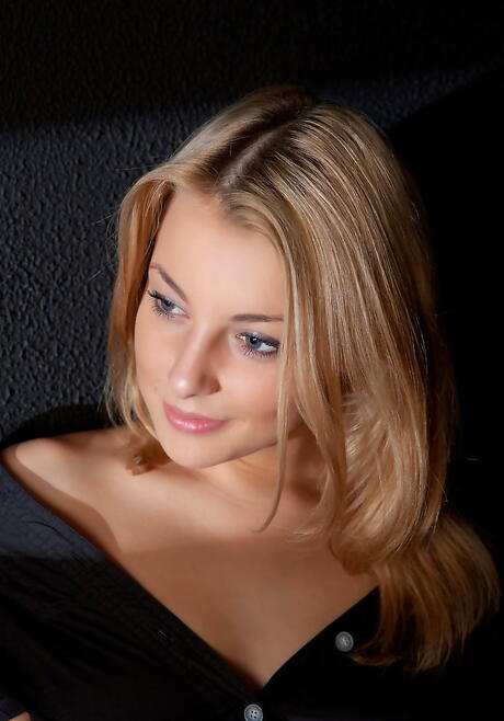 Stunning blond teen Nikia A in lingerie posing
